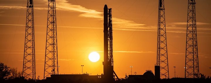 Photo of a rocket overlooked by a sunset