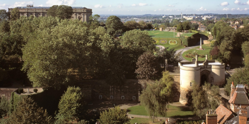Sunny arial view of Nottingham castle surrounded by trees