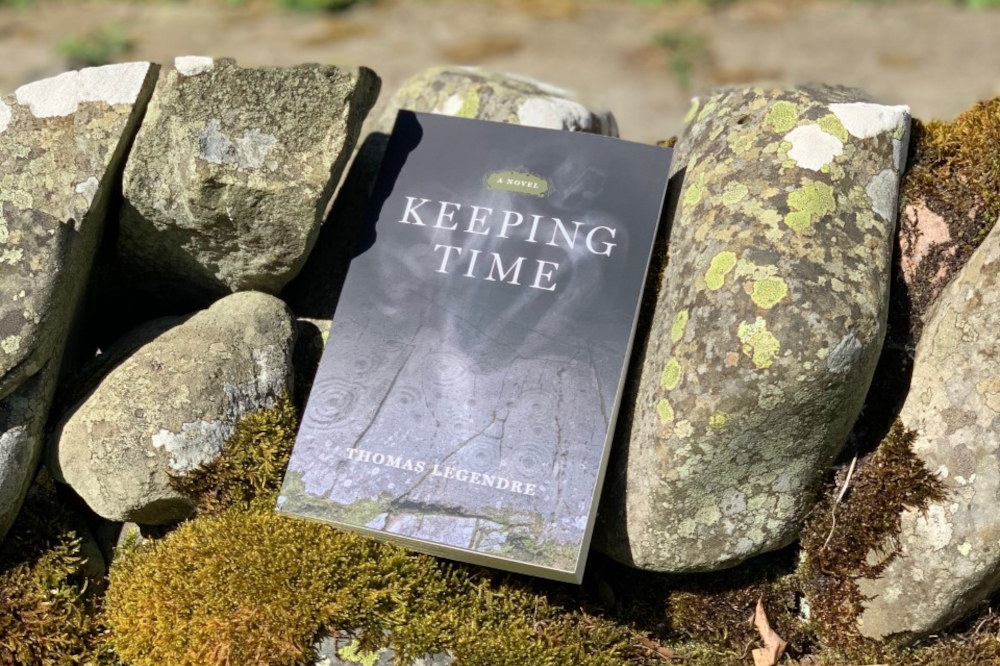Copy of Keeping Time resting on a dry stone wall