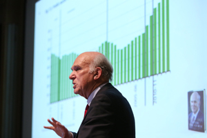 Close up of Sir Vince cable presenting his work