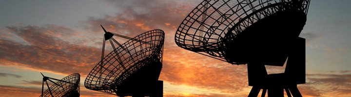 Three radio telescopes at dusk