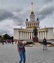 Molly on her year abroad posing for a photo in front of an iconic Russian monument