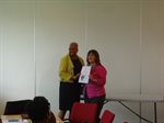 Lisa receiving award from Eunice