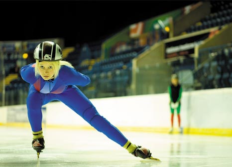 Female postgraduate speed skater and sports bursar training at the National Ice Centre, Nottingham