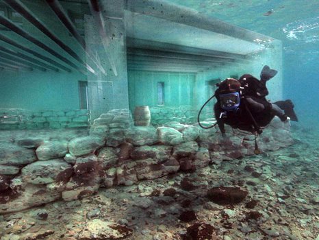 Diver underwater in ruins of Pavlopetri