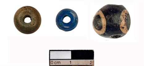 Image of three old beads (two brown and one blue) with a size guide underneath showing that they range between 1-2cm in diameter
