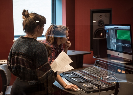 female students computer recording studio