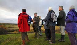 Stuart Rose leading a group of visitors on a guided walk of Laxton
