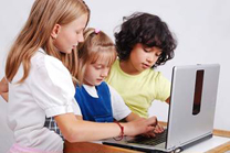 Children looking at a computer