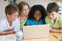 children looking at laptop