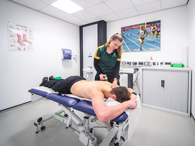 A patient receiving shockwave therapy in our Sports Injury Clinic