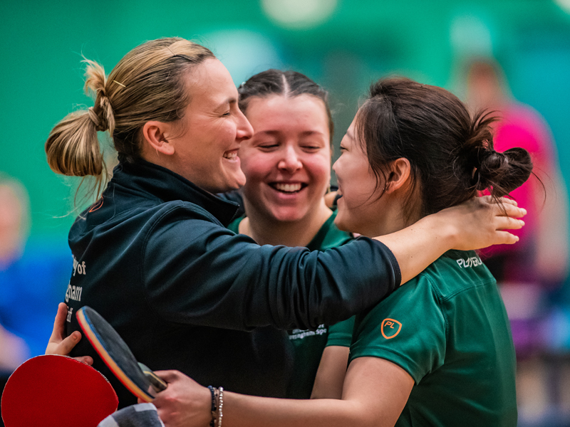 University of Nottingham Table Tennis players celebrate with their coach