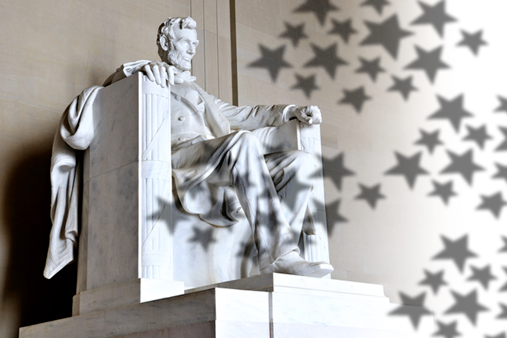 A photo of the Abraham Lincoln statue with stars overlayed on the right hand corner.