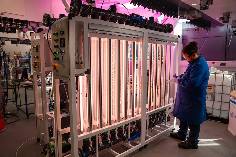 An engineering PhD student using a pilot scale bioreactor suite