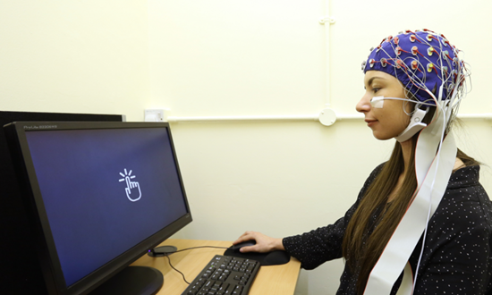 A person using eye-tracking equipment.