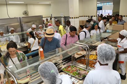 People queuing for food at a canteen
