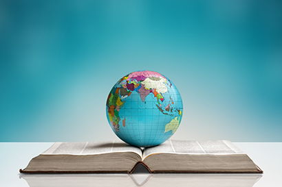 Image of a globe sat on a book