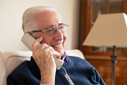 Smiling senior man talking on phone