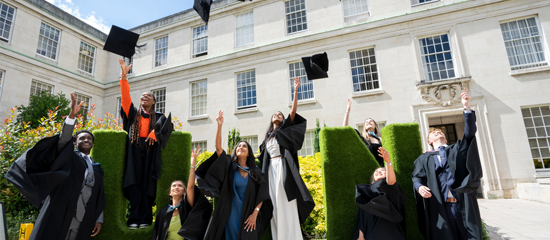 Graduates celebrating at graduation