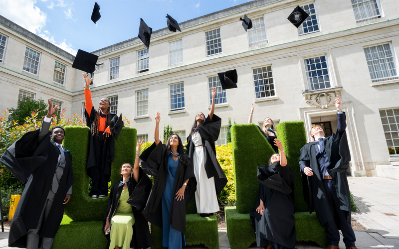 Graduates celebrating at graduation