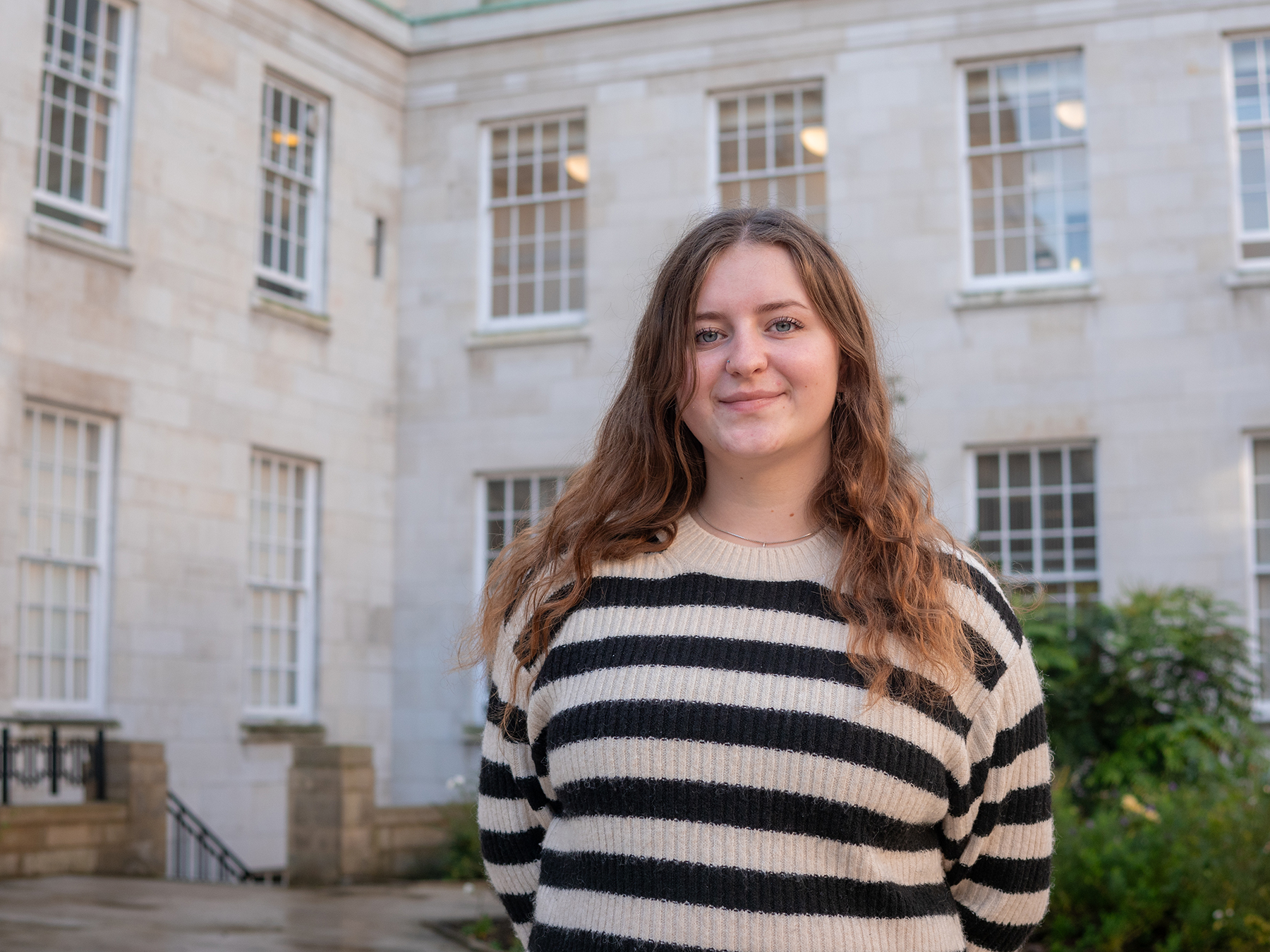 Lucy Smith standing in the Trent Building Courtyard.