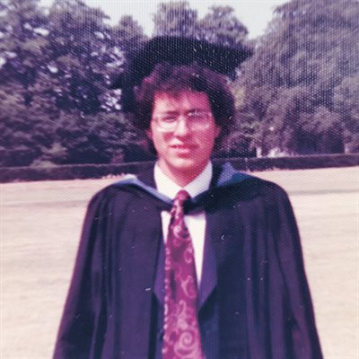 Peter Kingsbury in graduation gown.