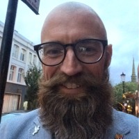 Head and shoulders portrait of Tom Hemmings smiling