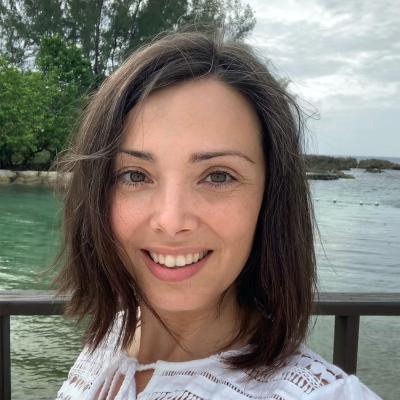Head and shoulders portrait of Veronica Layunta Maurel smiling