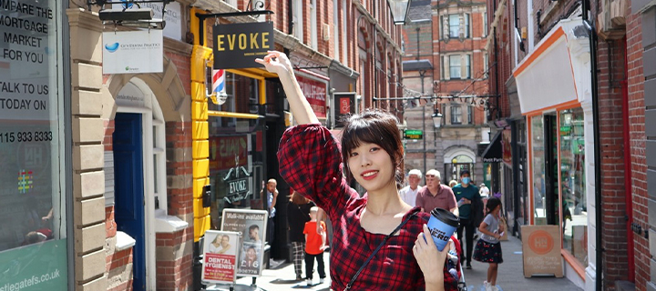 Alumni Wan standing in Nottingham City Centre smiling