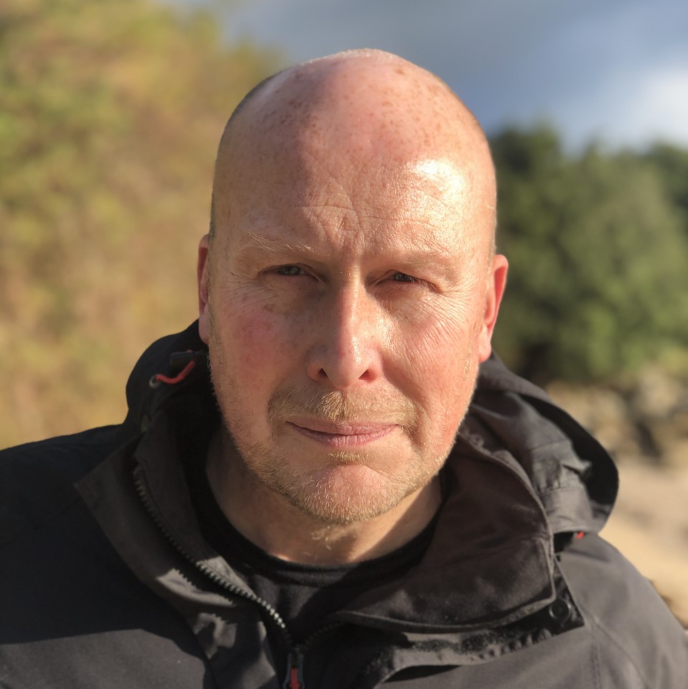 A head and shoulders portrait photo of Robert Lambert