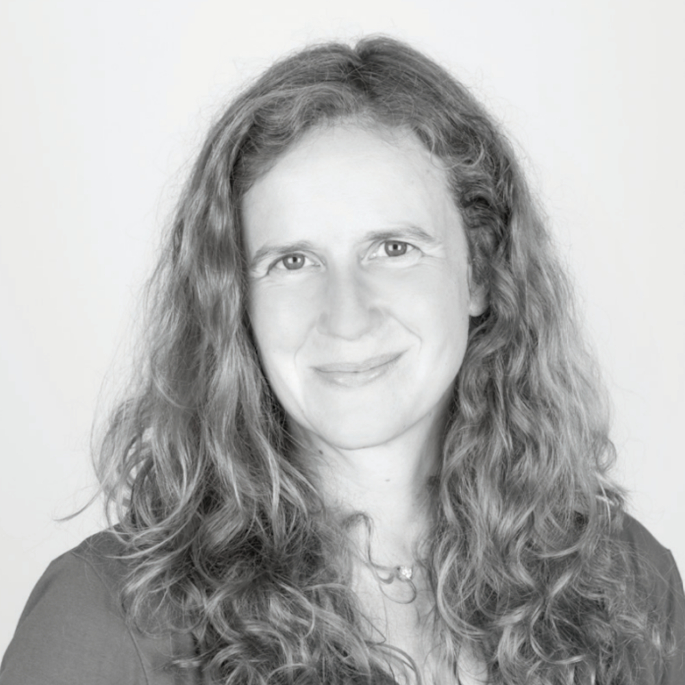 A head and shoulders portrait photo of Sarah Badcock