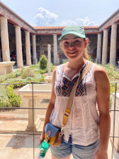 A three quarter length colour photograph of Juliette Marinelli