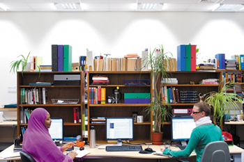 Research students studying in the library.