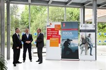 Three businessmen in Business School atrium