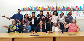 Marina Novelli is sat at a table in a classroom with colleagues and PGT and PGR students from at Tshwane University of Technology (Pretoria).