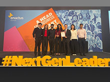 Group of students on stage at the Enactus UK & Ireland World Cup Qualifier at Expo ExCeL London on 7 to 8 April 2025, standing behind large yellow 3D letters spelling #NextGenLeader