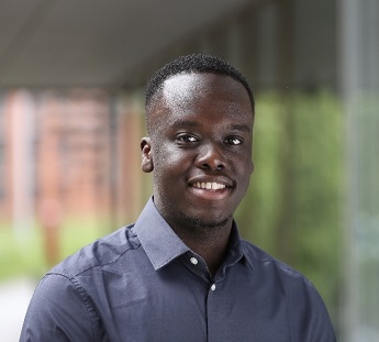 Chris Victor smiling and wearing a dark blue shirt