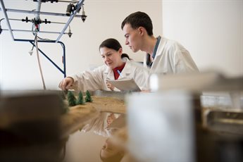 Undergraduate student and staff working in the Geography Laboratory