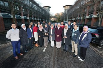 Members of the Digital Leadership and Innovation for Public Sector Transformation programme stand together for a group photo outside the Castle Meadow Campus training suite.