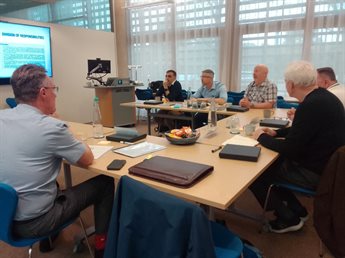 Members of the Executive Board from Nottingham City Transport sit around tables during their programme