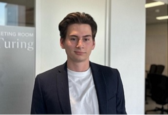 Joshua Aaron wearing a white tshirt under a blue blazer