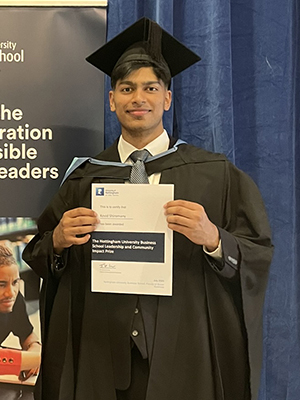 Kovid Shiromany - BSc Industrial Economics graduate - wearing his graduation cap and gown