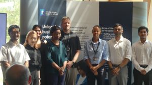 MSc Company Consultancy Competition presentation. Team Notts County Foundation runners up standing in front of a large banner: Mentor Professor Andrew Bacon, Business partners Emma Trent and Josh Stevenson, students Anudeep Sridhar, Akilsurya Palanisamy G