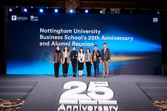 Alumni standing in front of a 25 year Anniversary sign. Blue background with large text, Nottingham University Business School's 25th Anniversary and Alumni Reunion