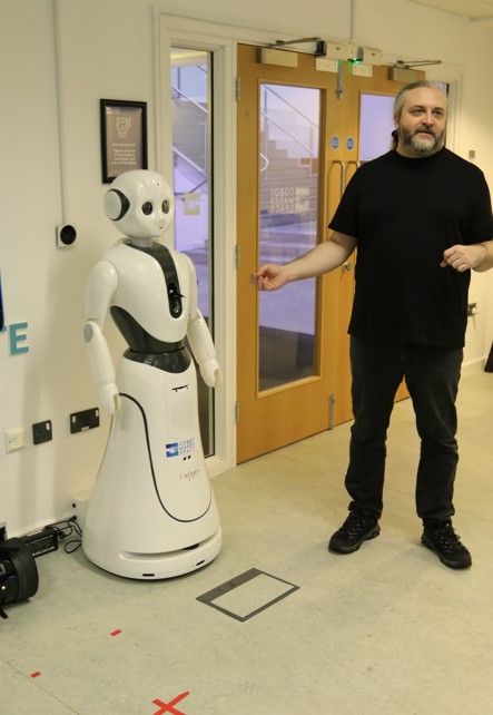 Dominic Price introducing placement students to the different types of robots in the CMS lab.