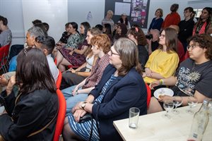 Exhibition participants listening intently