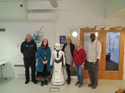 Group photo following the tour of the CMS lab space