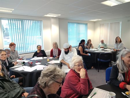 A section of attendees listening intently.