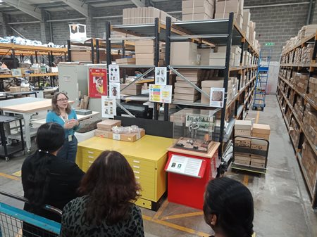 Helen Sharp leads a phase of the tour of the collections at the Eastern Annexe facility.