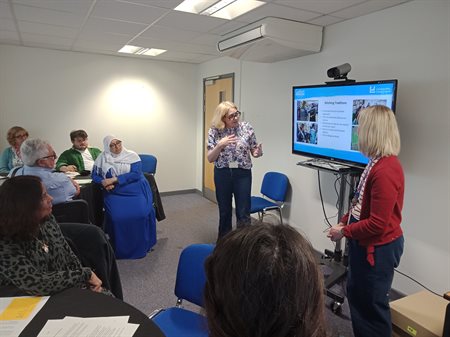 Esther Shaw and Alison Clague discussing the 'Stitching Traditions' project.